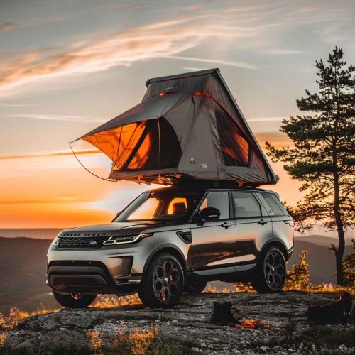 Aluminum shell triangular roof tent-12 Rooftop tent for camping on top of high mountain at sunset